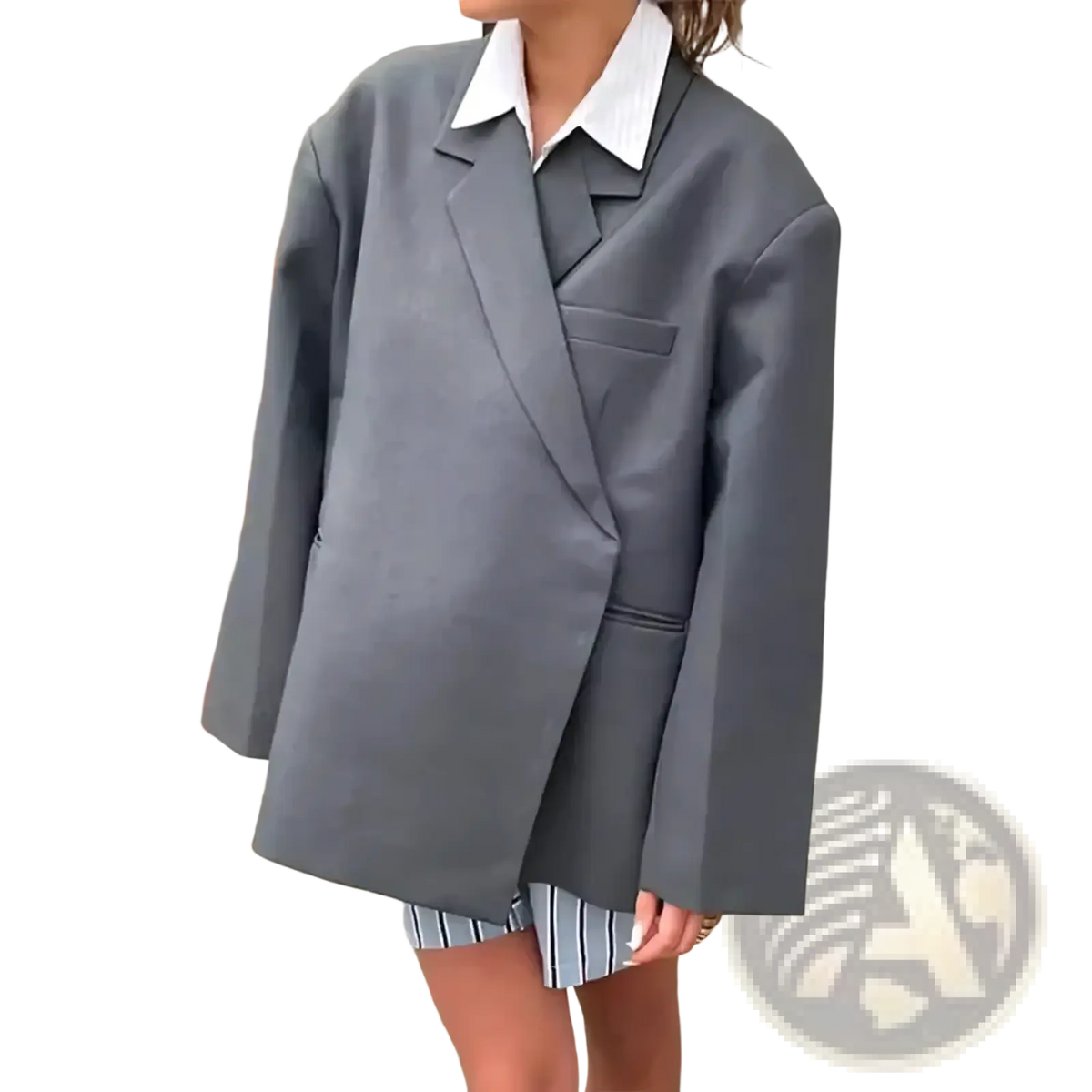 Woman wearing an oversized gray blazer and white collared shirt holding a red patent leather tote bag