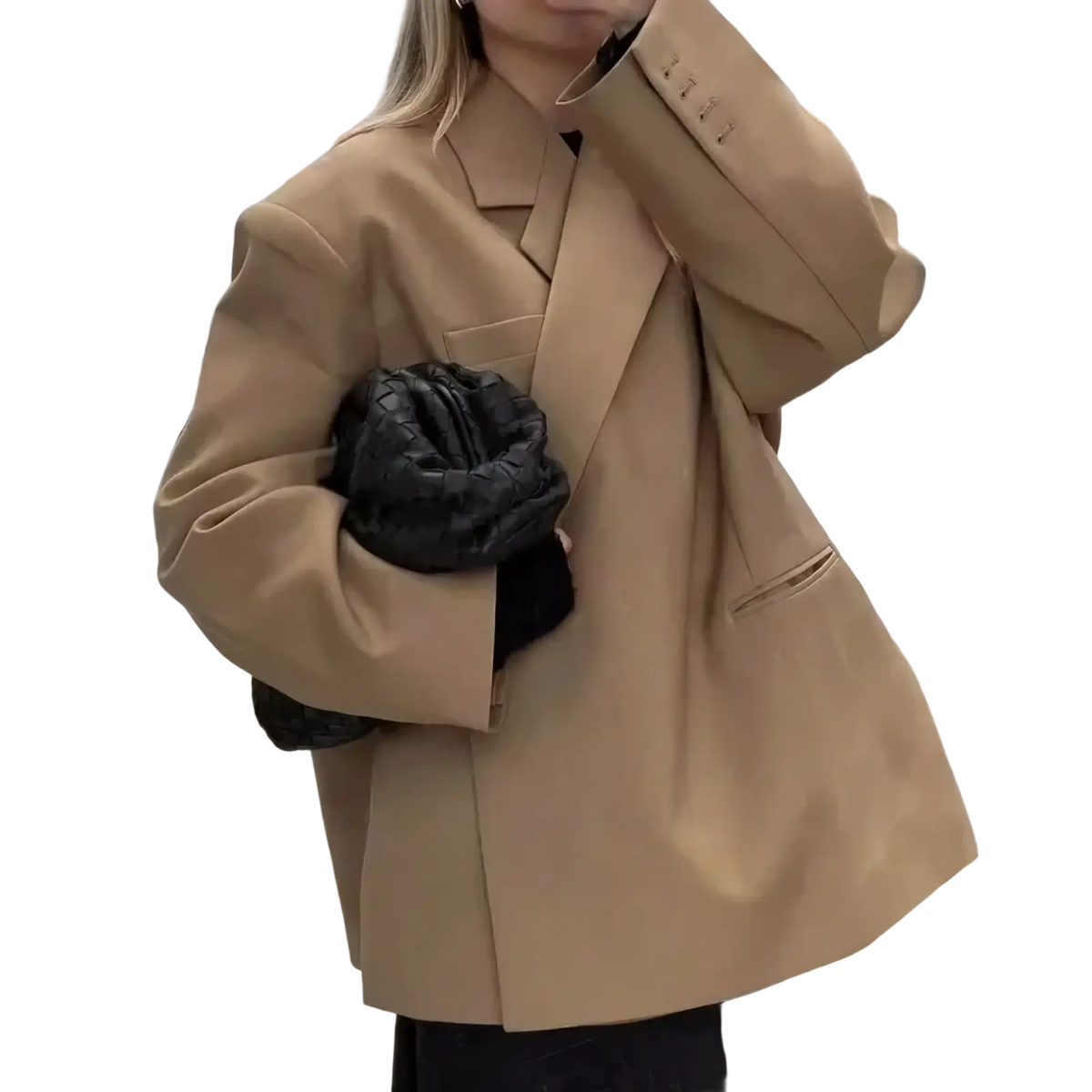 Women red patent leather tote bag shown with tan oversized blazer with structured shoulders and black quilted handbag