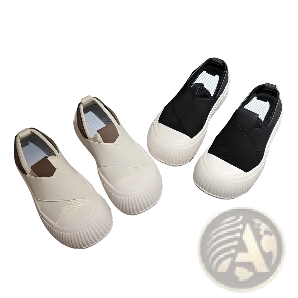 A pair of women retro breathable slip-on casual sneakers in white and black with ribbed rubber sole and elasticated upper