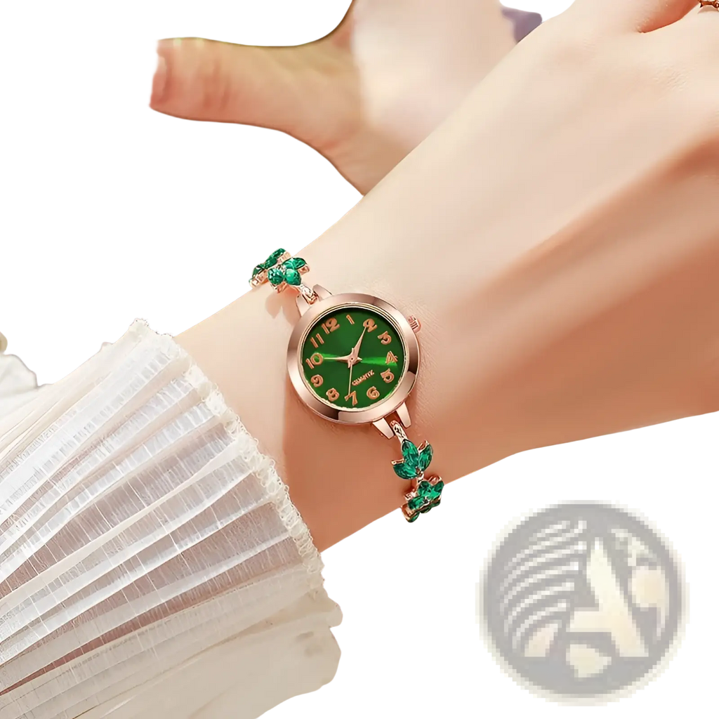 A delicate green and rose gold women rhinestone quartz watch with emerald accents and crystal leaf bracelet charms