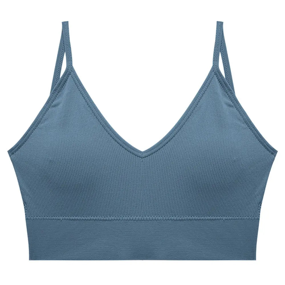 A sleek ribbed blue seamless v neck sports bra with thin adjustable straps and a flattering neckline