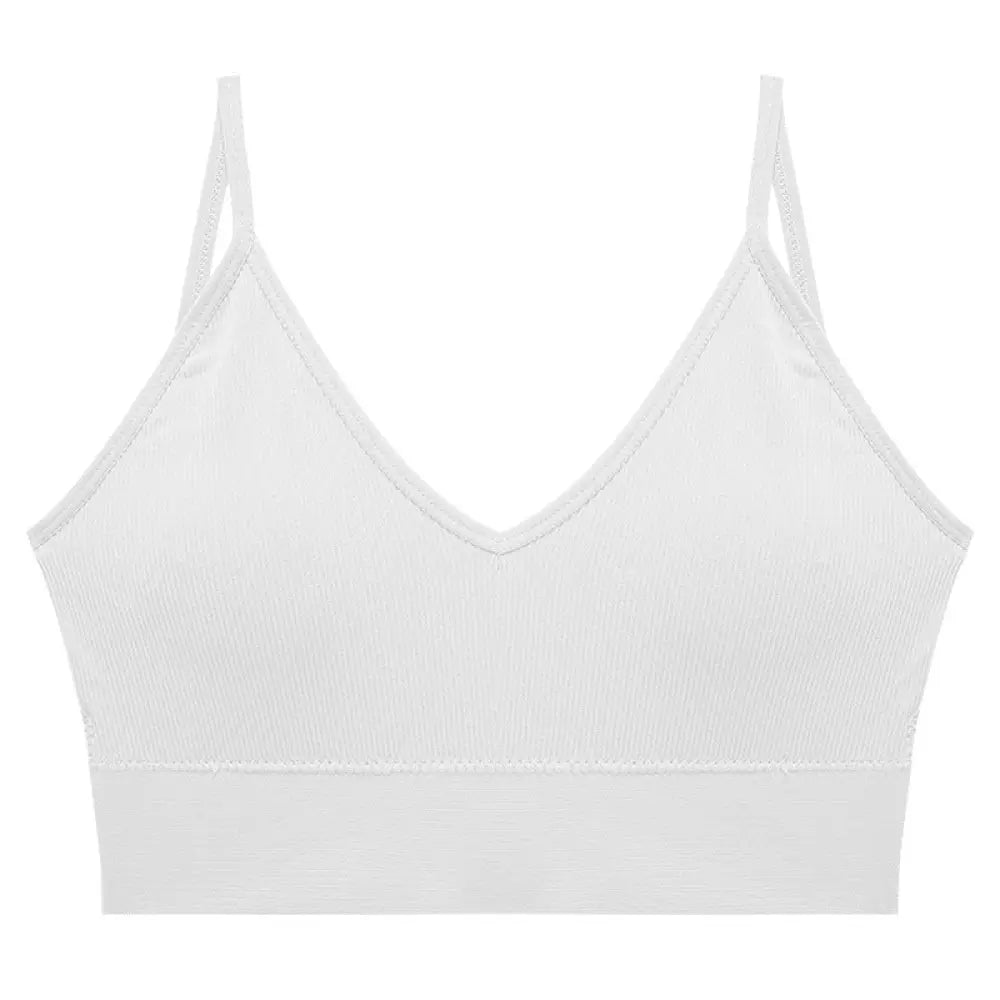 Seamless white ribbed knit sports bra with v-neckline and adjustable thin spaghetti straps for comfortable support