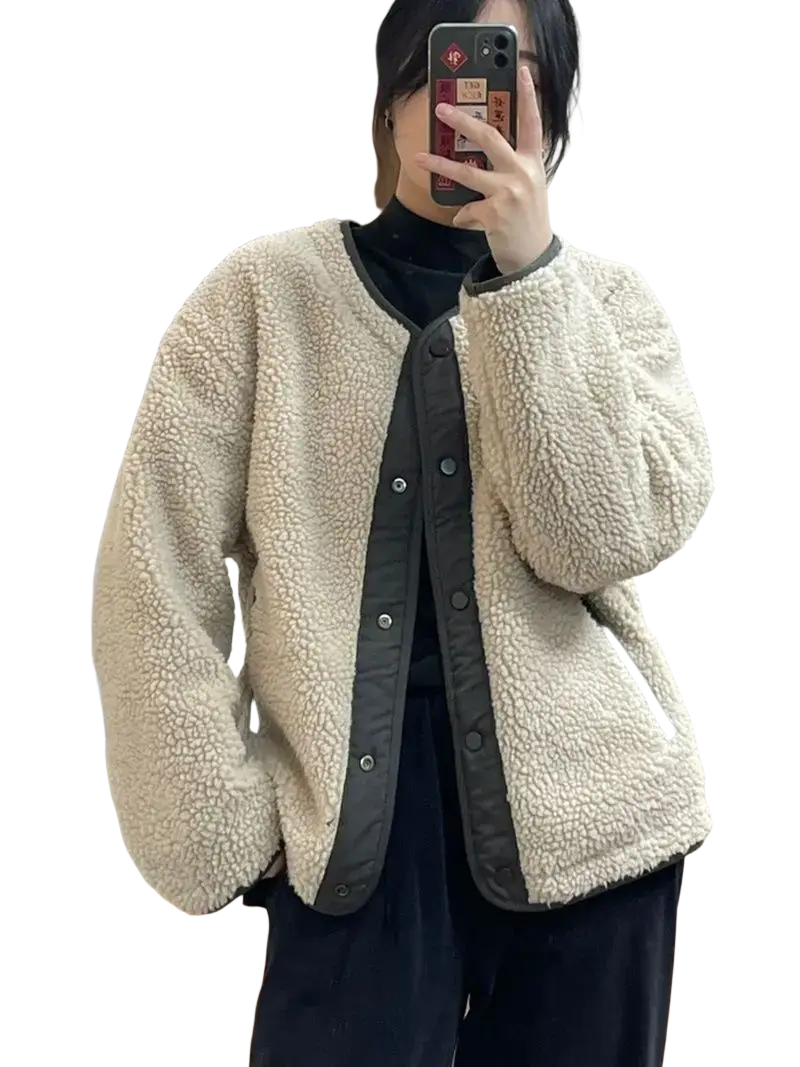 Women shearling bomber jacket in cream with dark gray trim and button closure made of soft shearling material