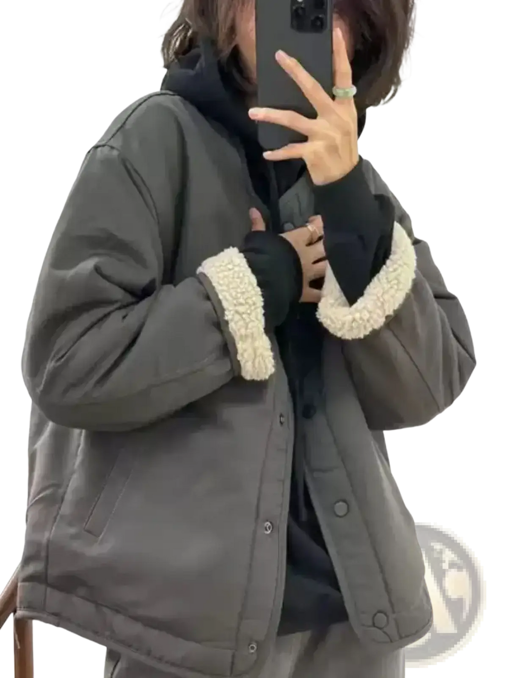 Women shearling bomber jacket in dark gray quilted fabric with cream-colored shearling cuffs visible from the front