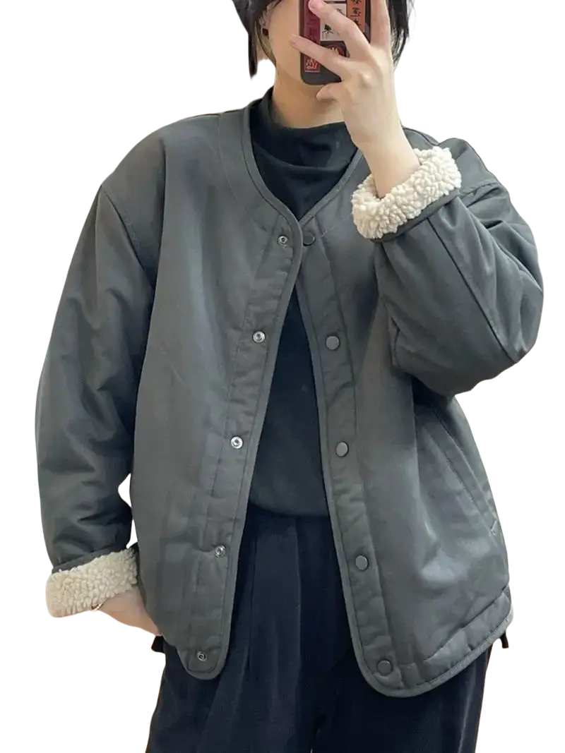 Gray quilted women shearling bomber jacket with plush white shearling cuffs and collar lining for cold weather