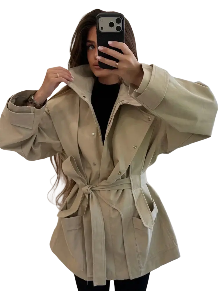 Women short beige trench coat with belt closures buttoned flap pockets in a lightweight utility fabric