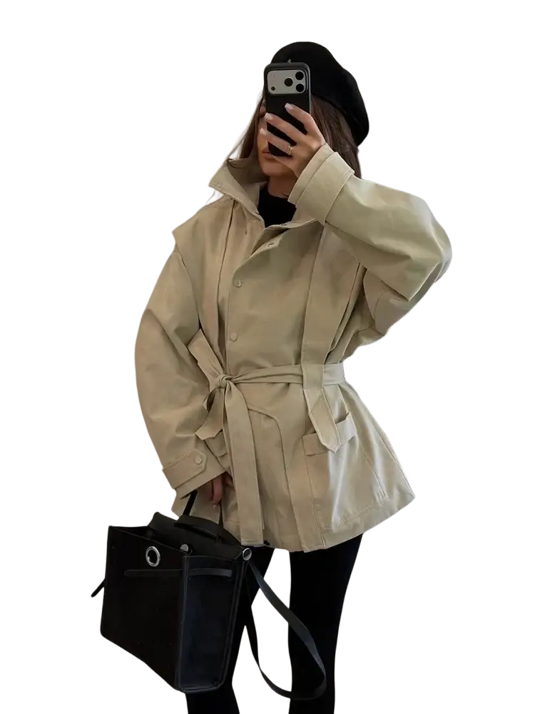 Women short beige trench coat with belted waist, structured collar, and buttoned front closure for utility wear
