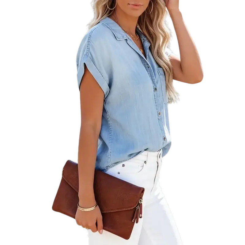 Brown leather clutch with zipper closure and tassel detail paired with women short sleeve denim casual top
