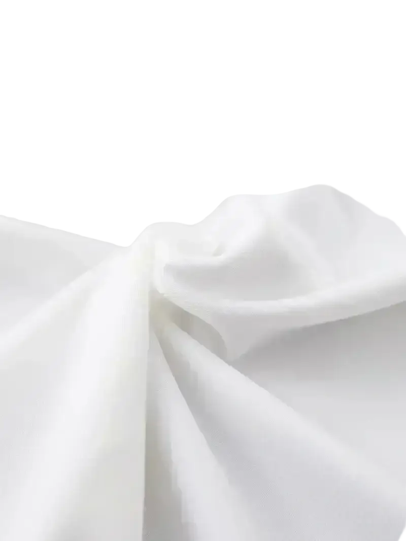 White soft flowing fabric of women short sleeve round neck casual top with smooth texture and gentle folds