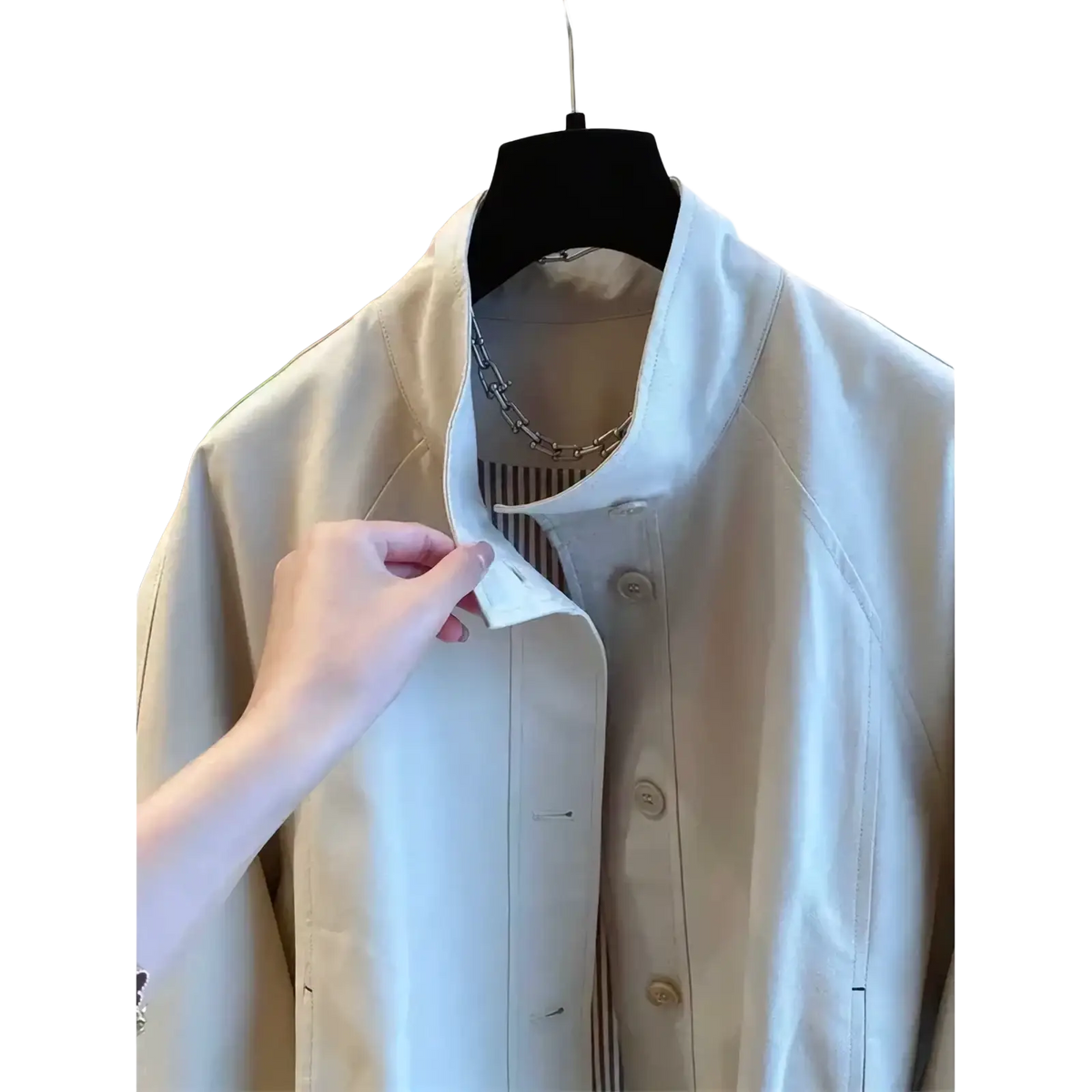 Beige women short striped lining trench coat with structured collar and matching buttons hanging on black hanger