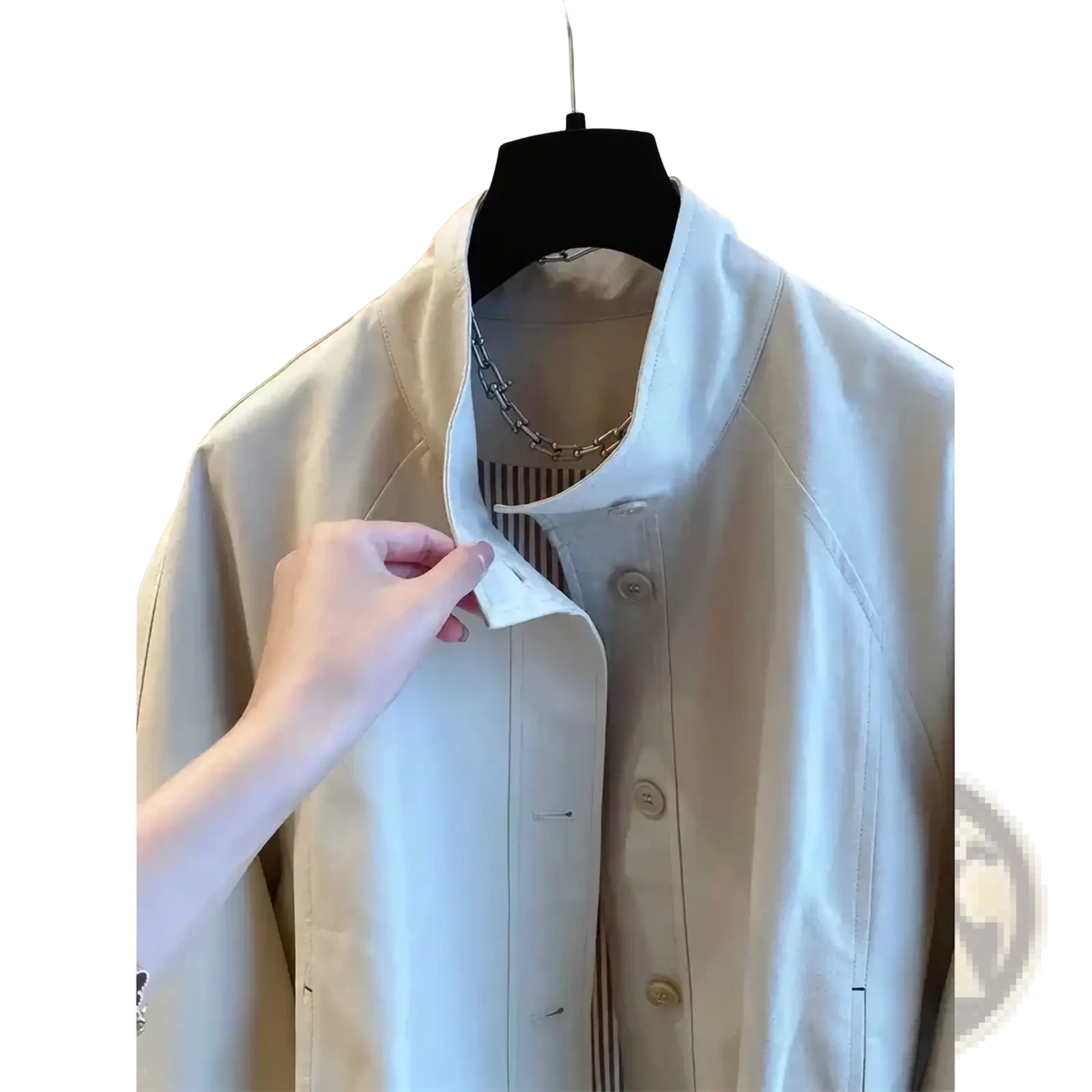 Beige women short striped lining trench coat with structured collar and matching buttons hanging on black hanger