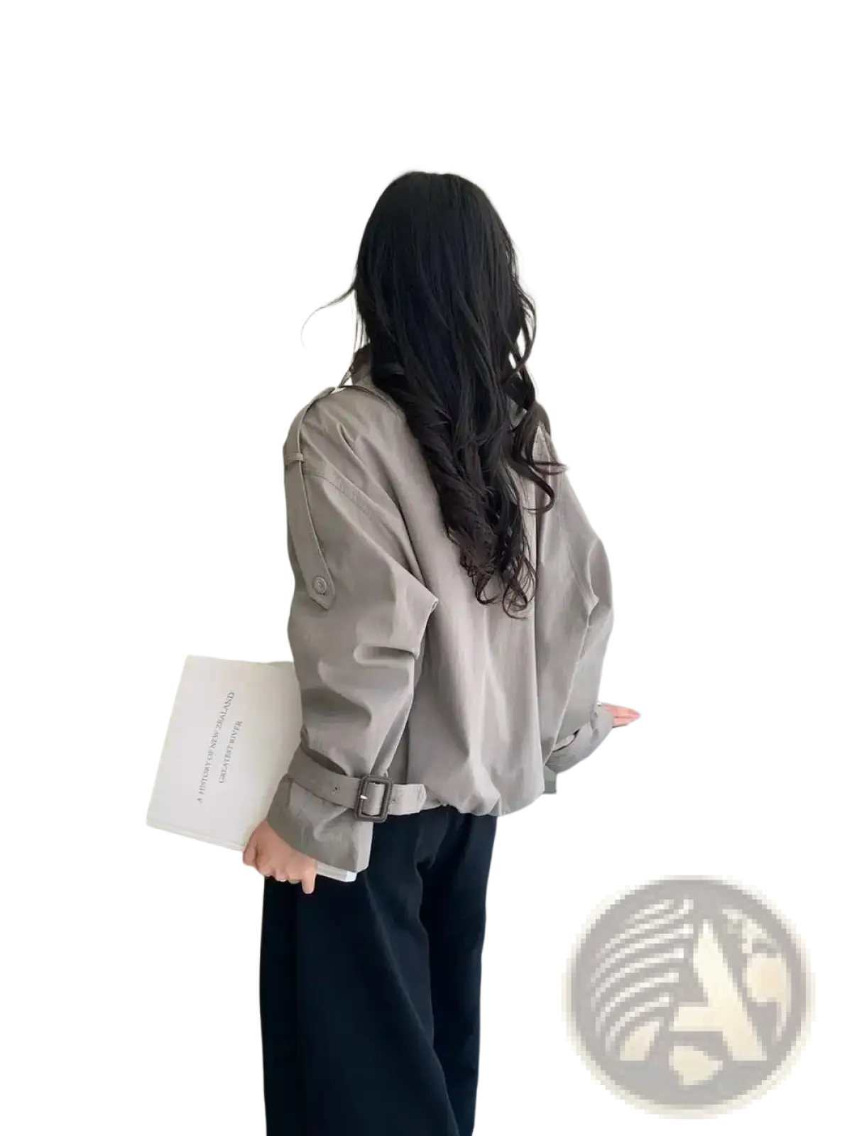 A woman wears a light gray belted short utility trench jacket with long sleeves and buttoned cuffs