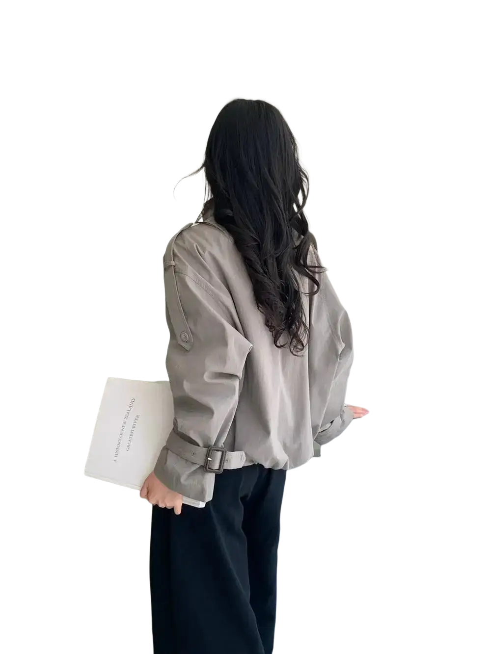 A woman wears a light gray belted short utility trench jacket with long sleeves and buttoned cuffs