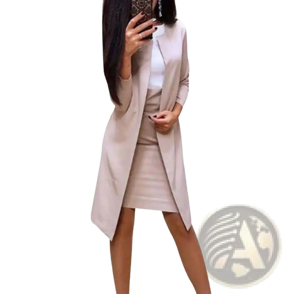 Beige longline cardigan with subtle sheen and asymmetrical hem paired with matching skirt for office business formal wear