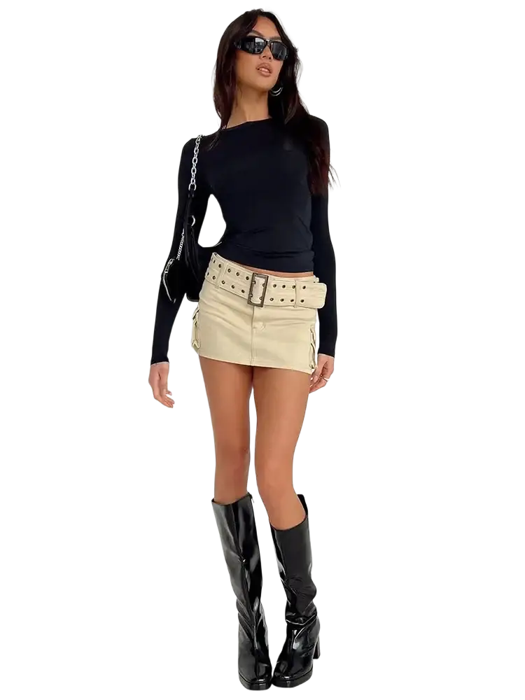 Beige denim mini skirt with wide studded belt and large buckle paired with women slim fit ruched long sleeve crop top