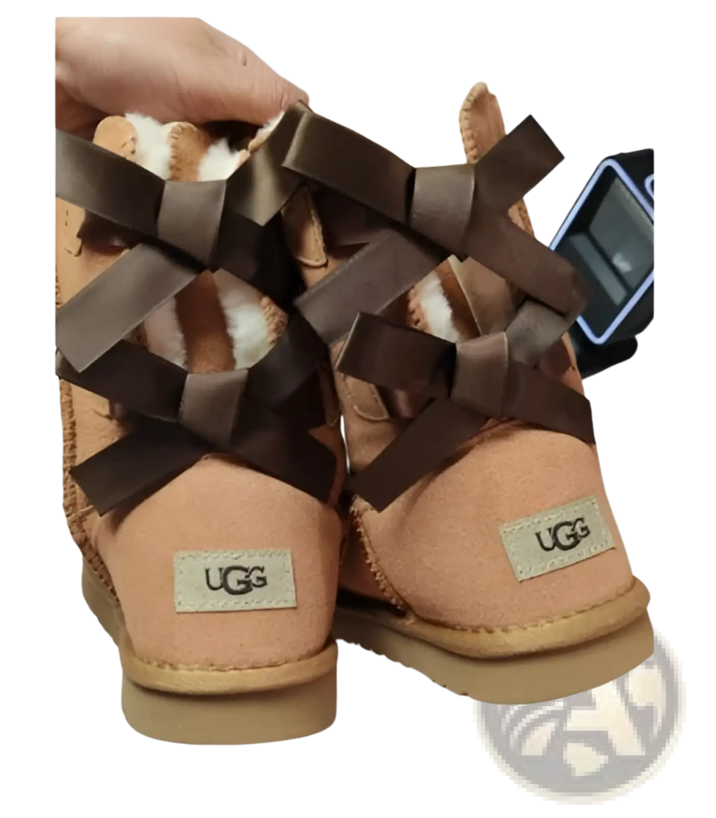 Beige women snow boot with warm suede fur and brown ribbon bows for winter ankle boots