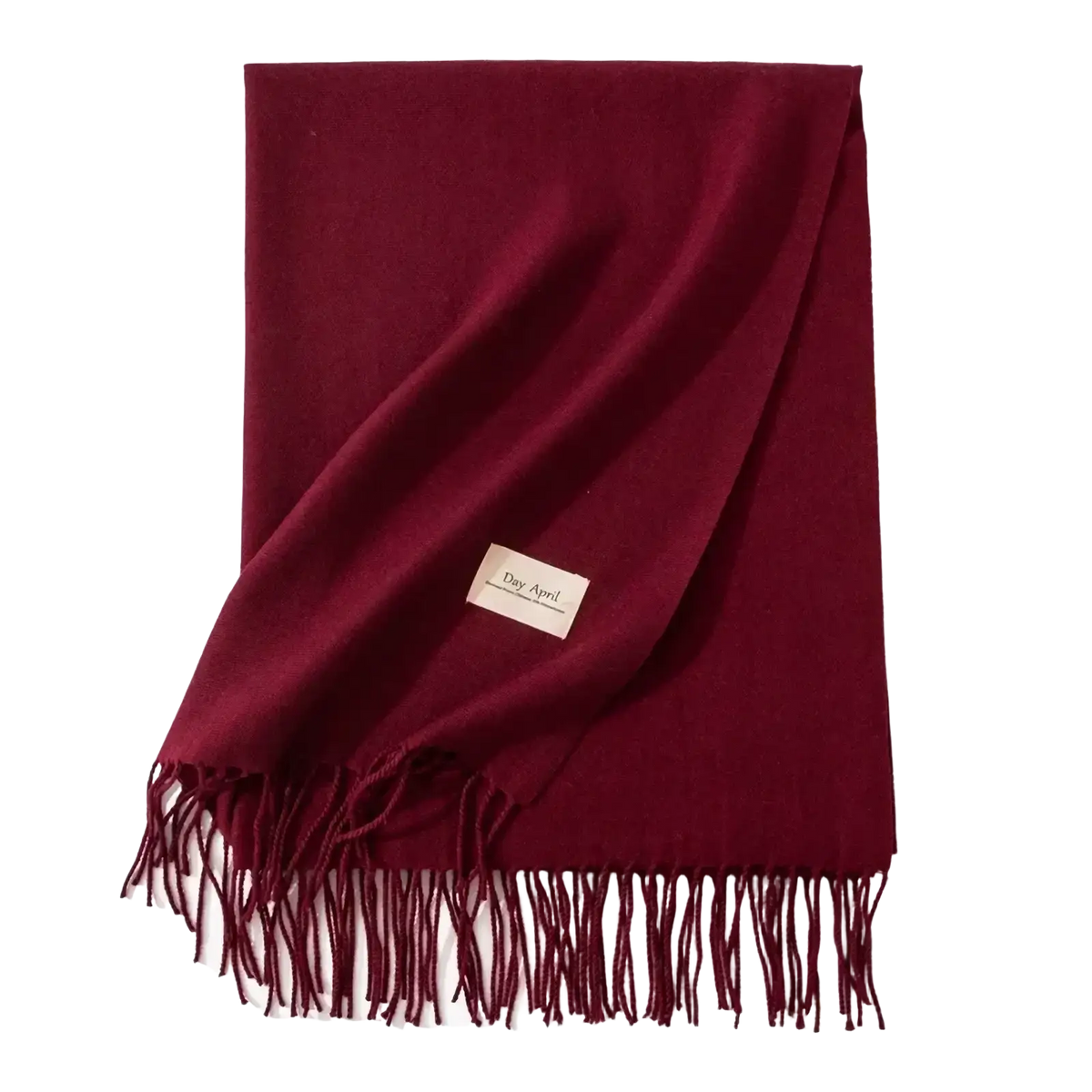 A rich burgundy solid cashmere winter scarf with soft fringed edges and a subtle woven label for warmth