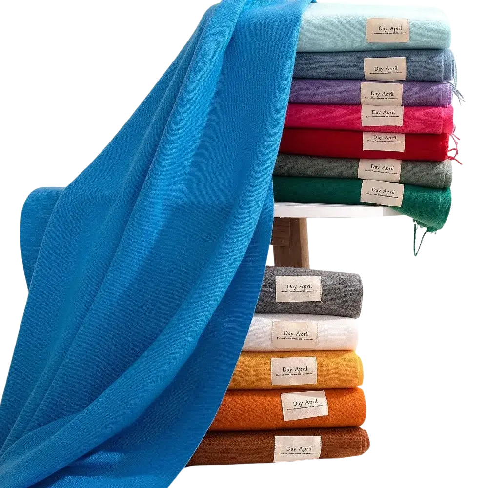 A vibrant blue knitted women solid cashmere winter scarf with a soft textured weave and neatly folded edges
