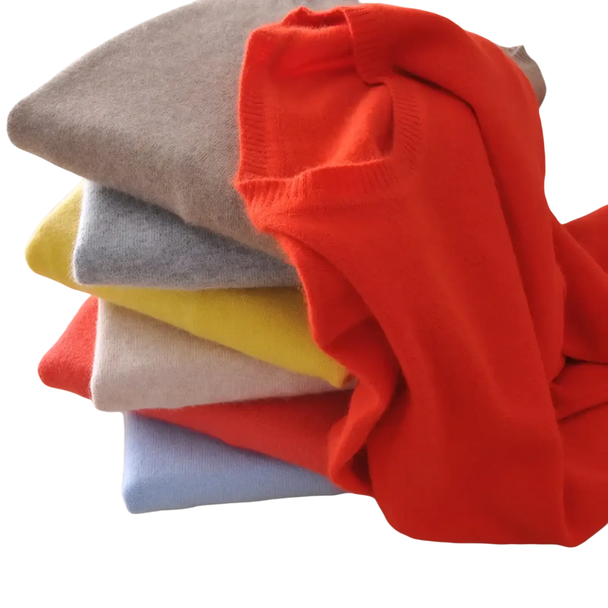 A stack of women solid knit pullover sweaters in vibrant orange and muted gray yellow light blue and cream colors