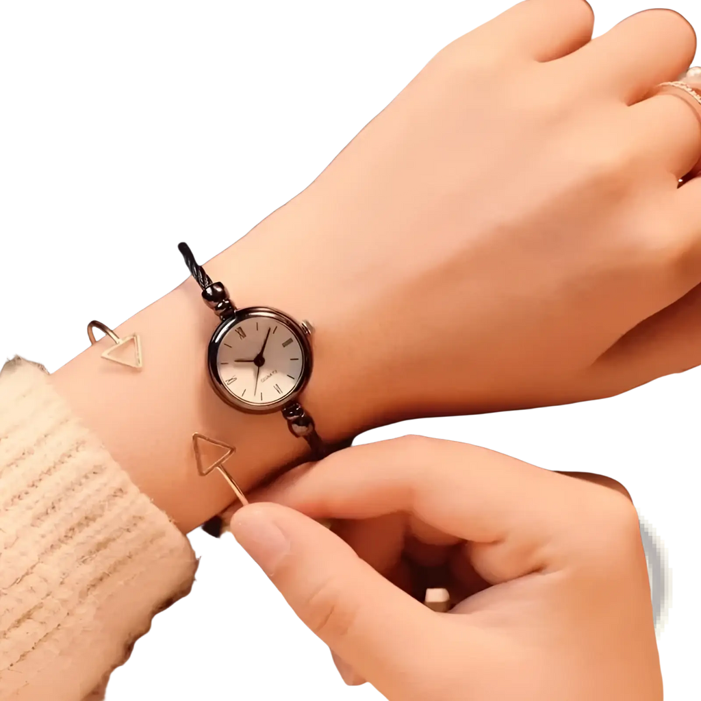 Women stainless steel quartz bangle watch with a black braided bracelet and white face featuring roman numerals