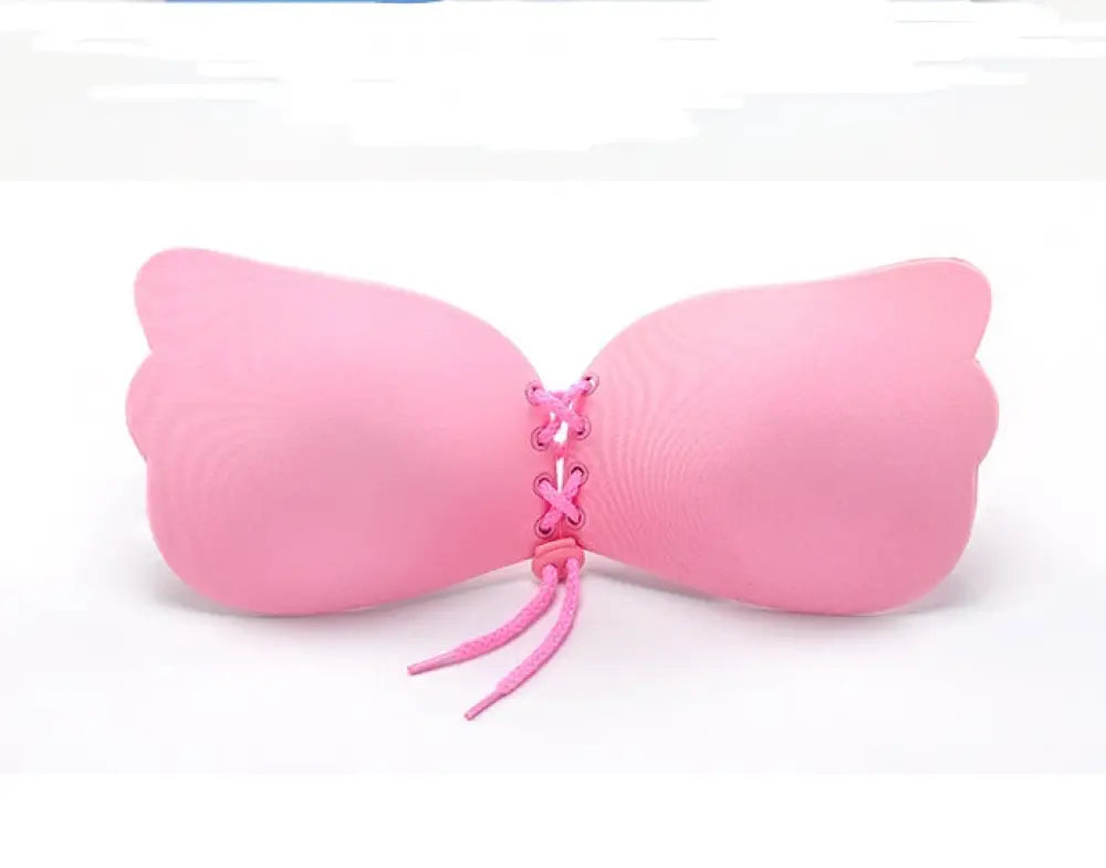 Pink silicone lace up adhesive strapless push up bra with adjustable straps and lace front design