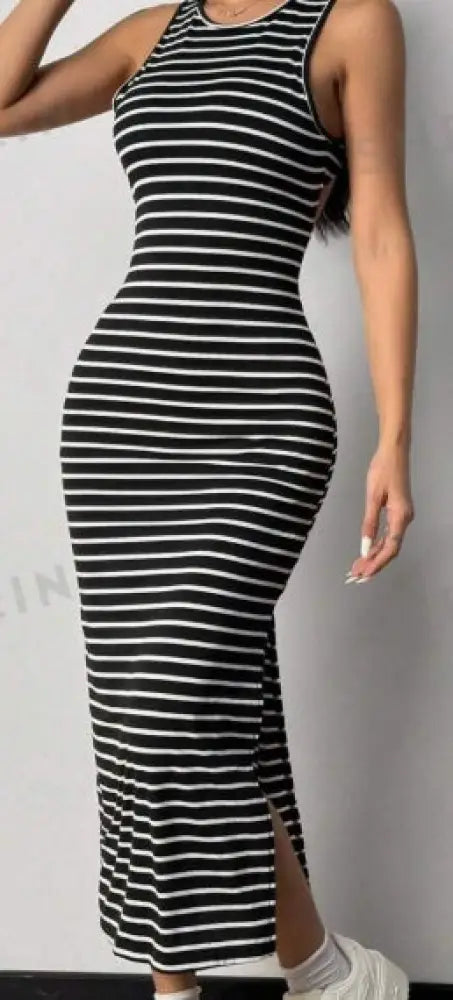 Striped backless knit midi dress in black and white with side slit sleeveless high neckline form-fitting design