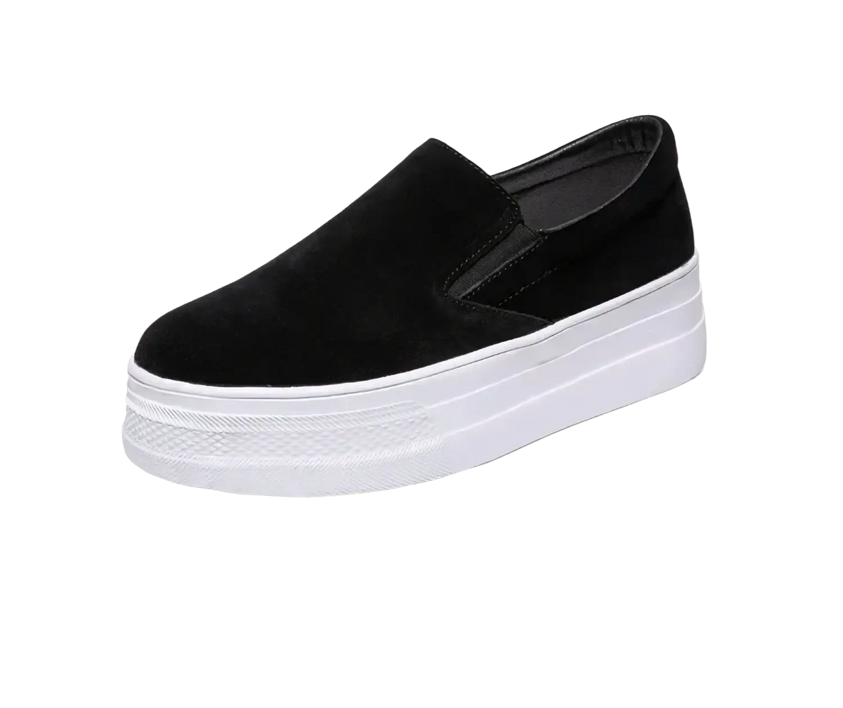 Black suede women slip-on sneaker with a thick white platform sole for casual and stylish wear