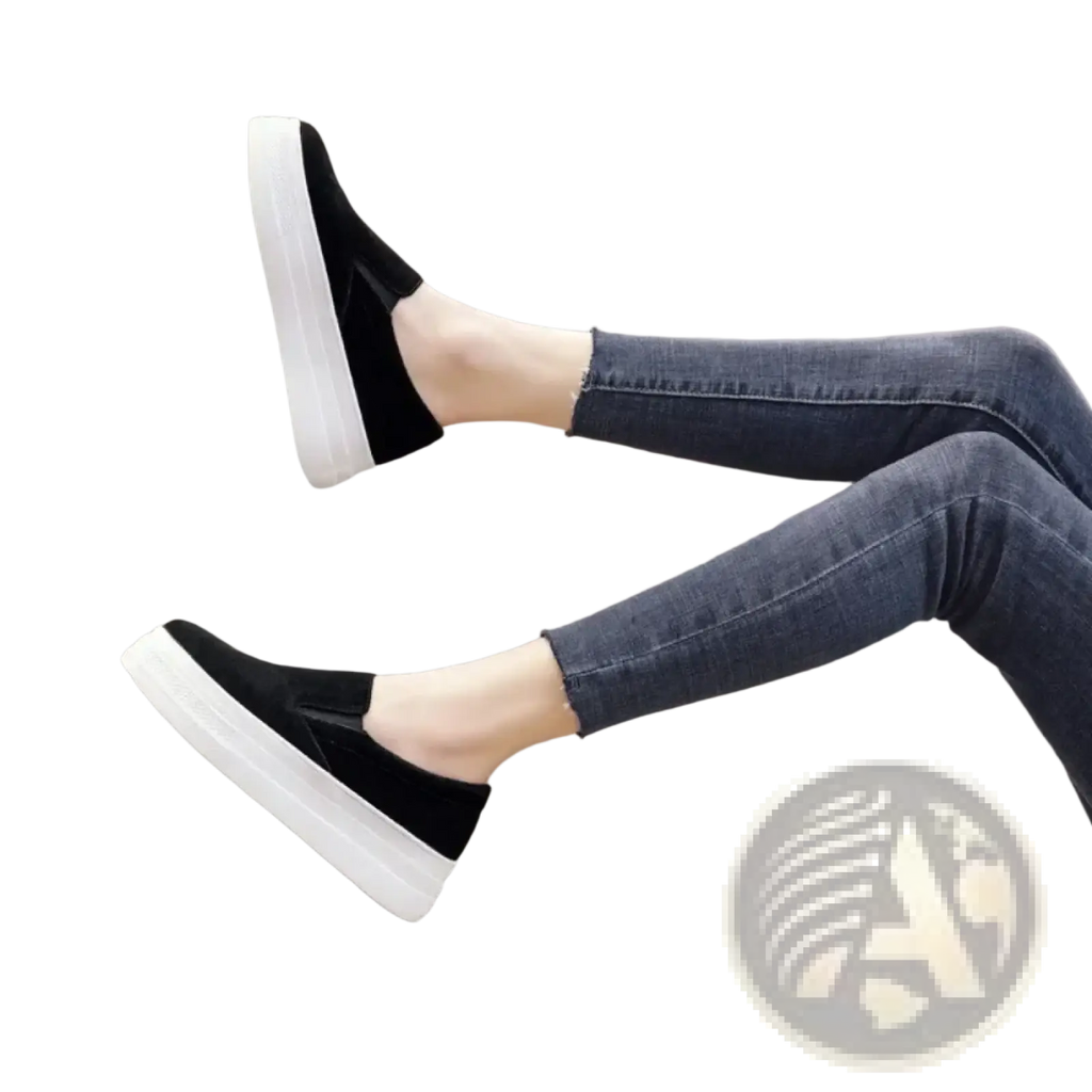Black suede women slip-on platform sneakers with thick white sole for casual wear shown from the back side