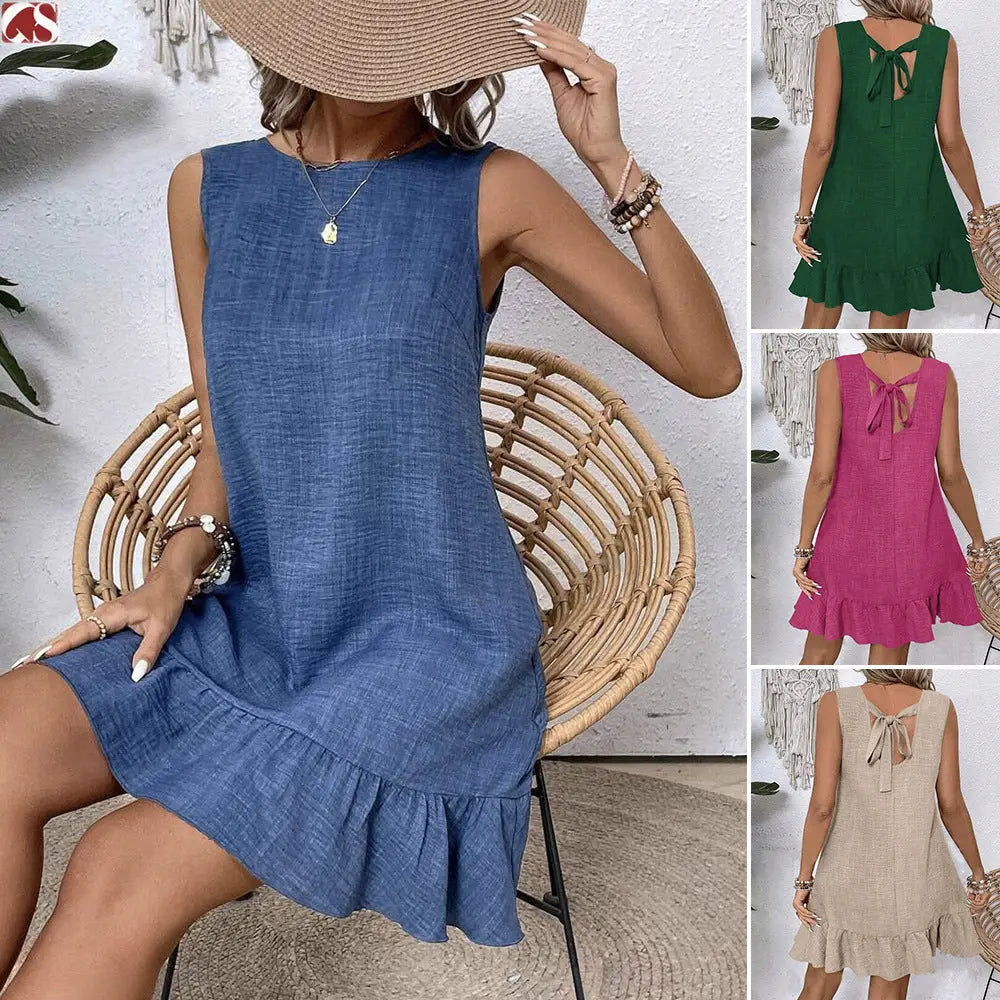 Blue sleeveless linen summer vacation beach dress with ruffled hem and back tie detail shown from the back side