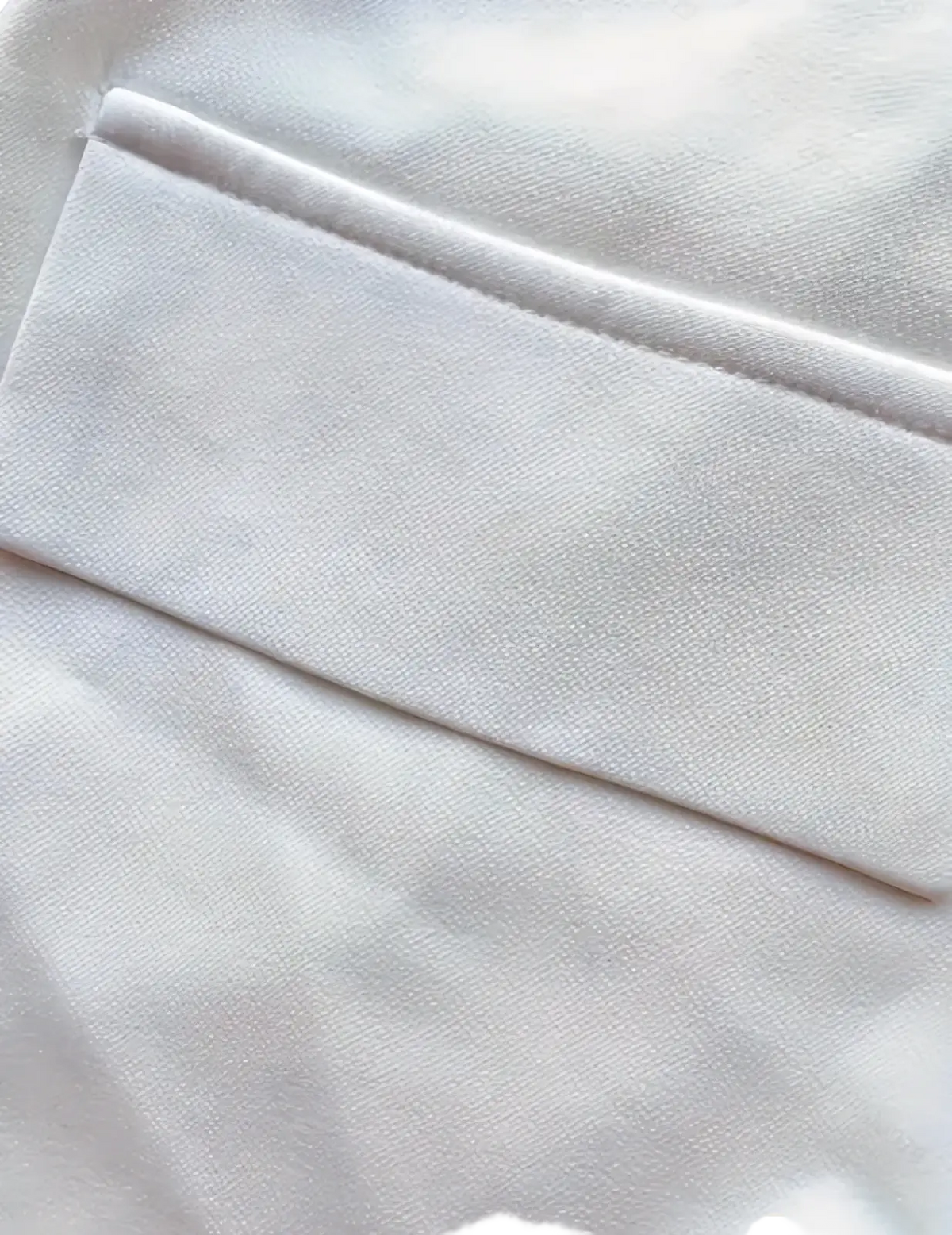 White tailored twill blazer for women with smooth satin-like fabric and neatly stitched seams for casual work wear