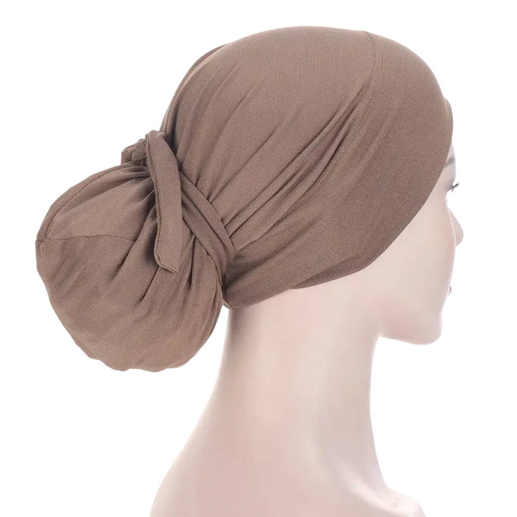 Beige stretchy fabric women tie-wrap hijab cap with a gathered knot at the back shown from the back side