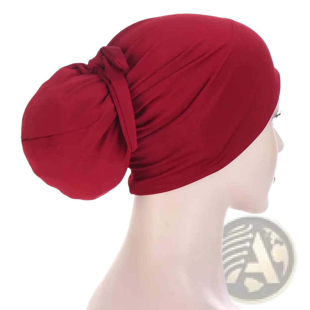 Back view of a soft solid red stretchy women tie-wrap hijab cap with a gathered knot for muslim headscarf use