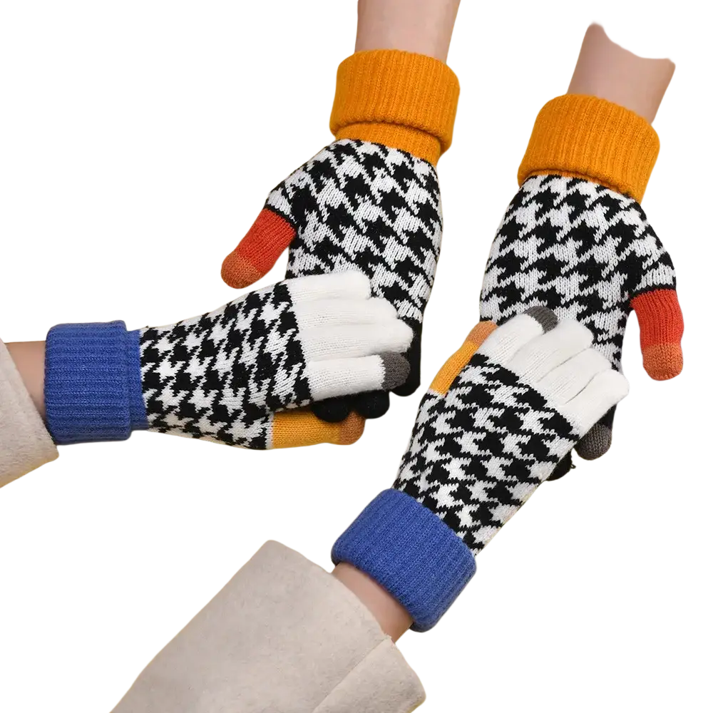 Women touch screen houndstooth knit gloves showing back side with black and white pattern and colorful fingertips in orange blue and gray
