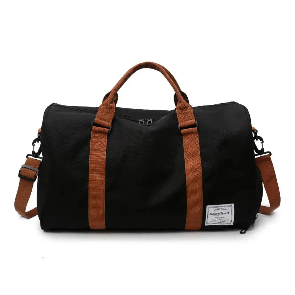 Black canvas women’s gym and weekend travel duffel bag with brown leather straps and handles