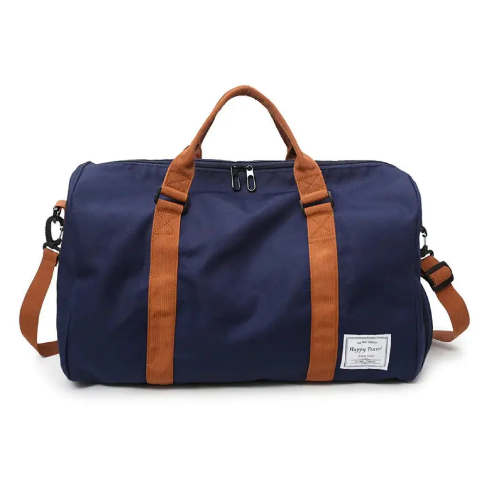 Navy blue canvas women’s gym and weekend travel duffel bag with tan leather straps and happy travel label