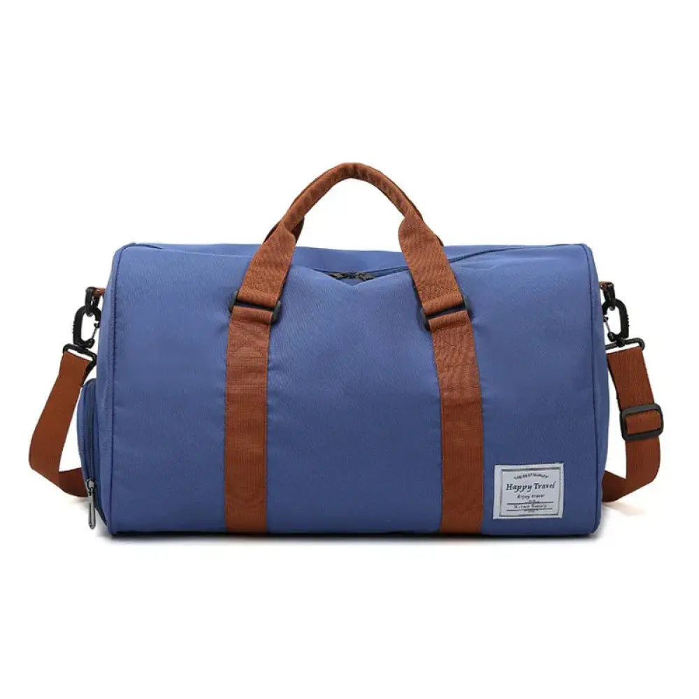 Blue canvas gym and weekend travel duffel bag with brown leather straps and happy travel label