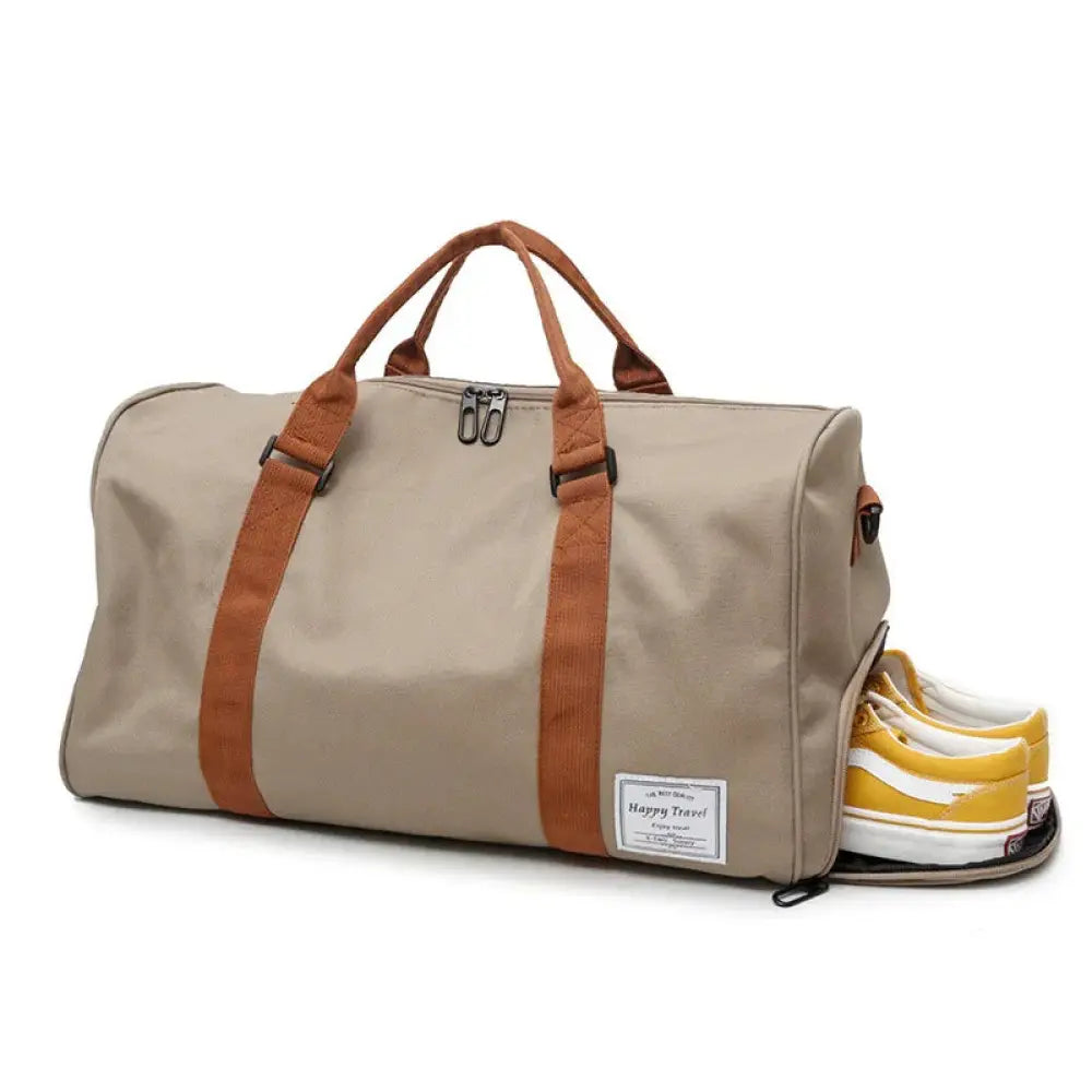 Beige and brown canvas women’s gym and weekend travel duffel bag with sturdy handles and side shoe compartment