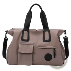 Beige nylon women travel duffel bag with black webbing handles and detachable shoulder strap large carry on tote