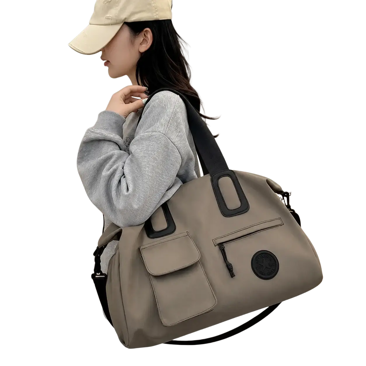 Beige women travel duffel bag with black reinforced handles and circular logo patch large carry on tote