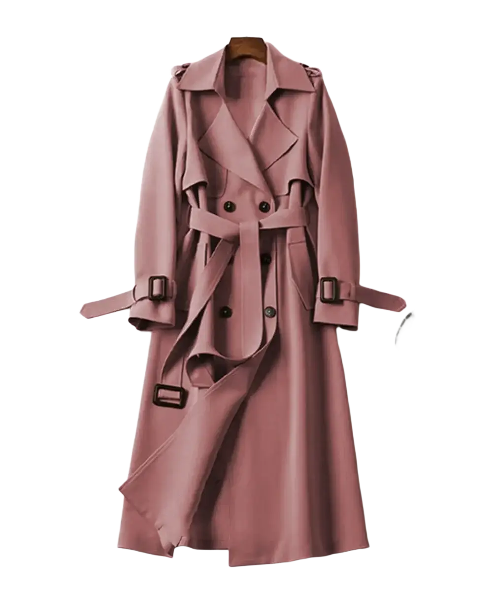A soft rose-colored double-breasted women’s trench coat with black buttons and matching belt straps