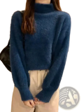 A plush deep blue women turtleneck fuzzy knit sweater with long sleeves and a soft textured fabric