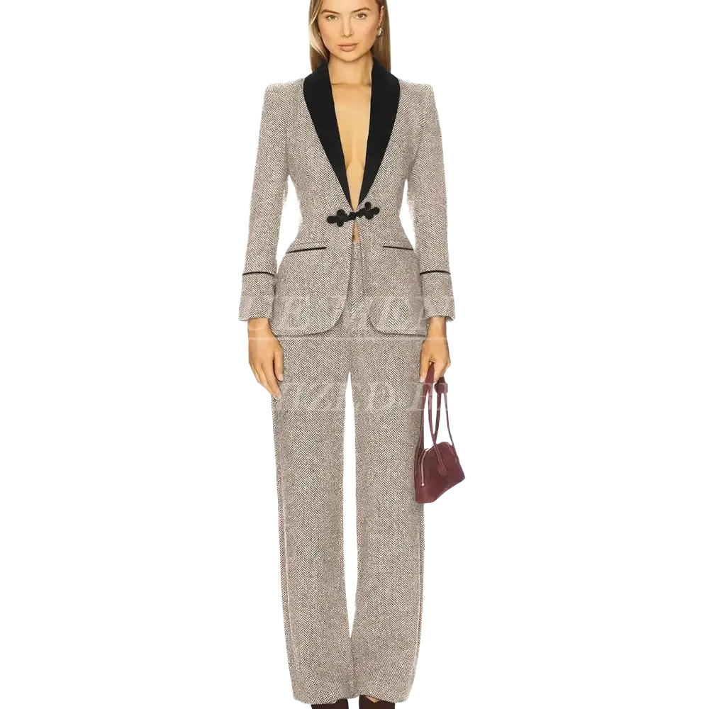A tailored women tweed pant suit blazer in gray herringbone with black velvet lapels and matching button closure