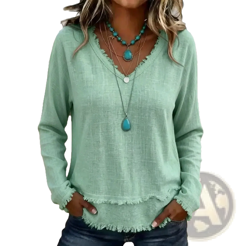 A soft mint green women v-neck long sleeve casual top with frayed hem made from comfortable fabric