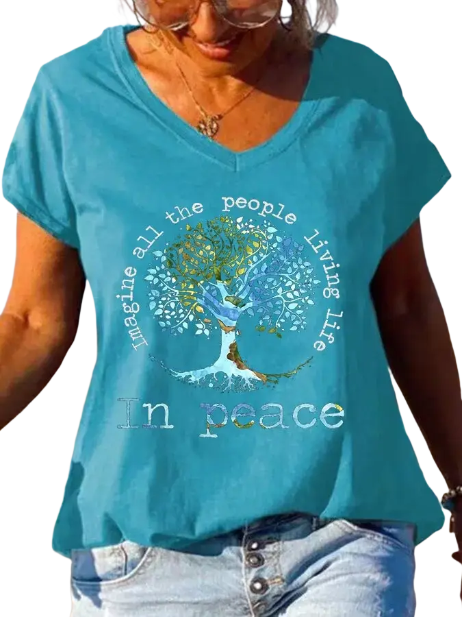 Women v-neck teal t-shirt featuring a detailed tree of life graphic with peace-themed text print on the front