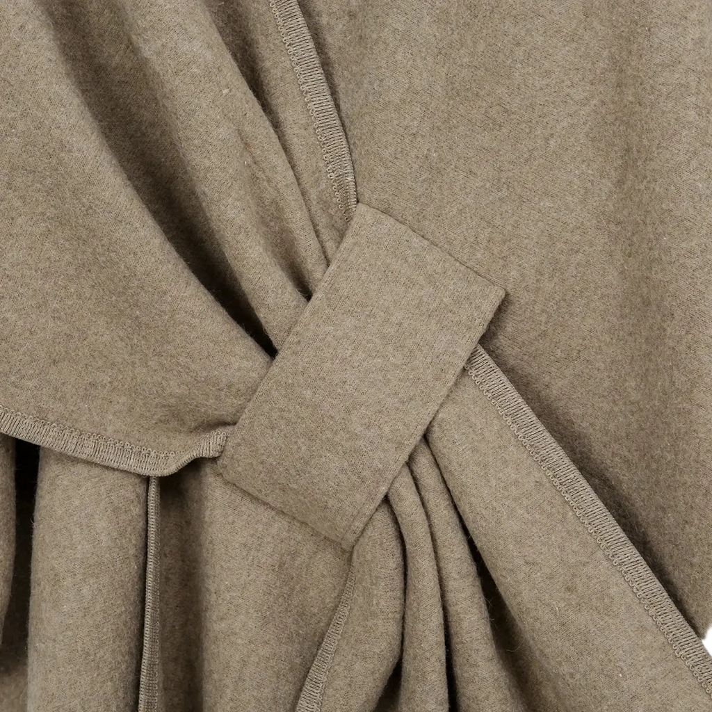 Women warm woolen poncho shawl cardigan in beige with a woolen coat texture and knotted belt detail
