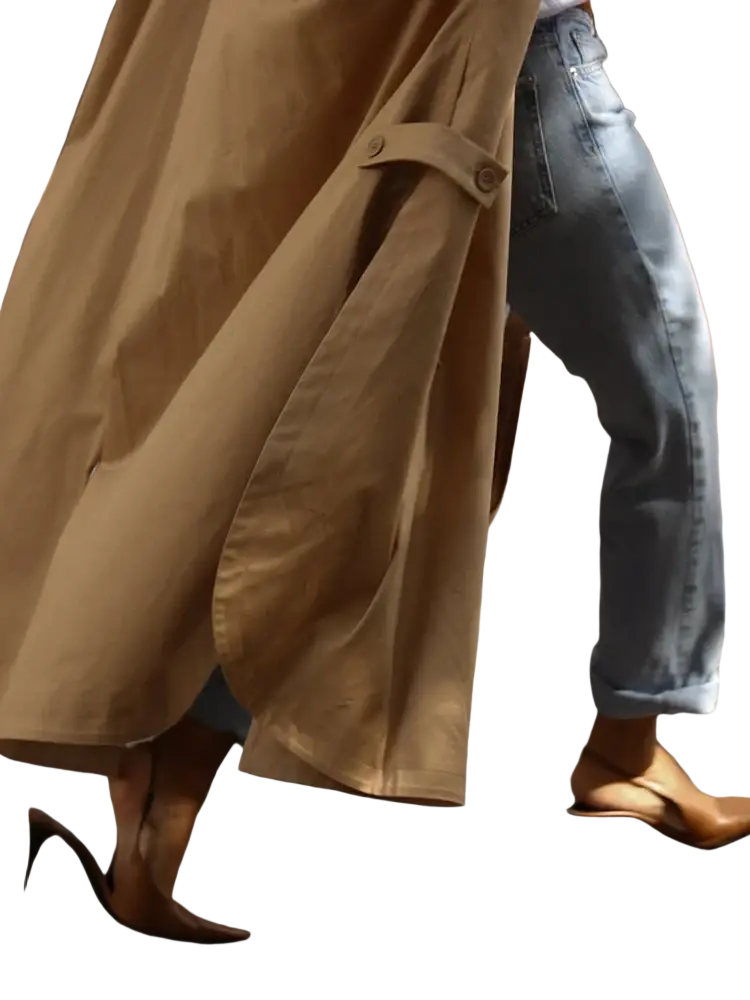 Tan women water resistant trench coat with puff sleeves, structured shoulders, and a classic belted design