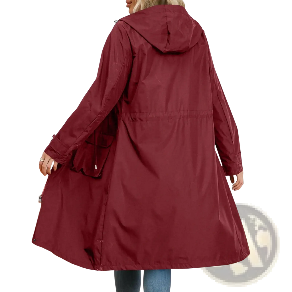 A maroon waterproof hooded trench coat for women with a drawstring waist and durable fabric