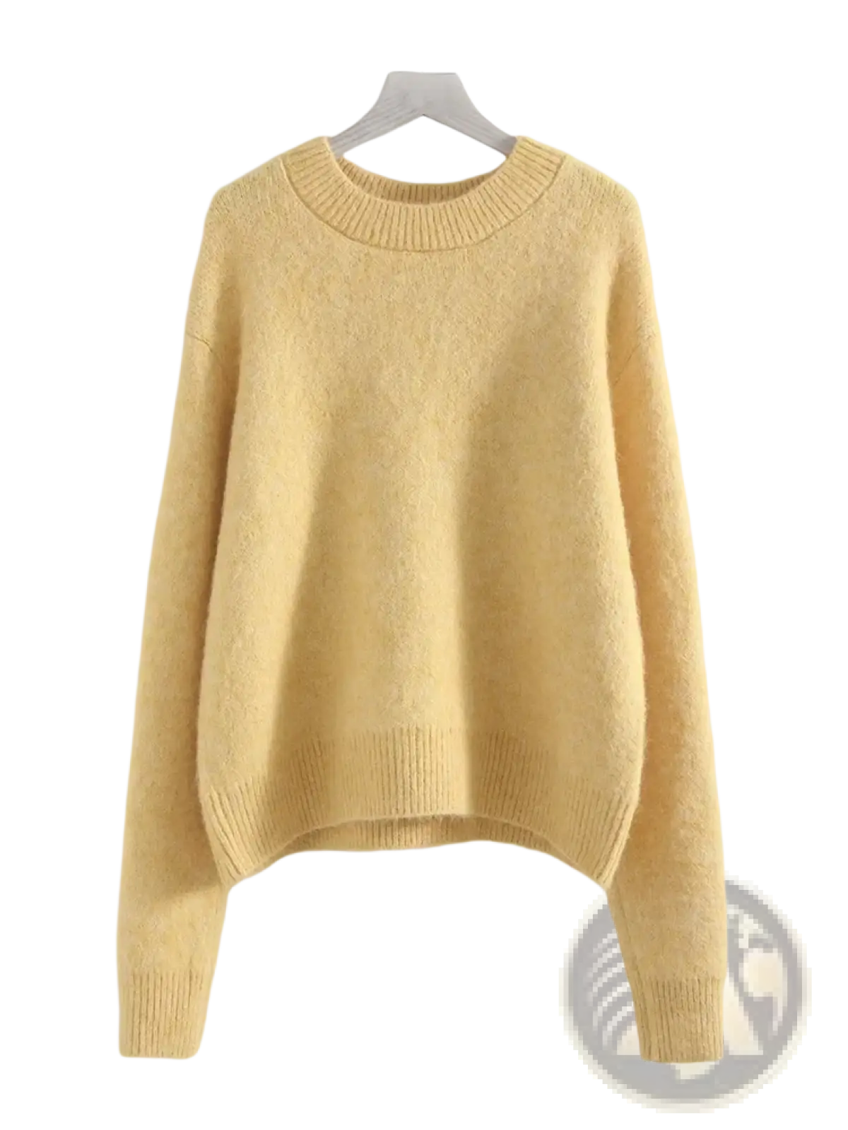 A soft pale yellow women winter knit pullover sweater with cozy textured fabric and ribbed cuffs