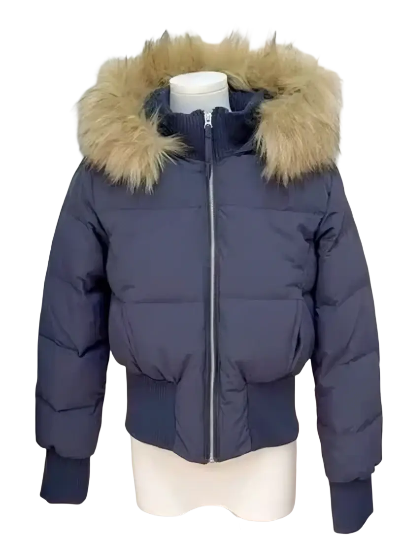 Dark blue women winter puffer coat with faux fur hood featuring a fluffy tan fur-lined trim for cold weather