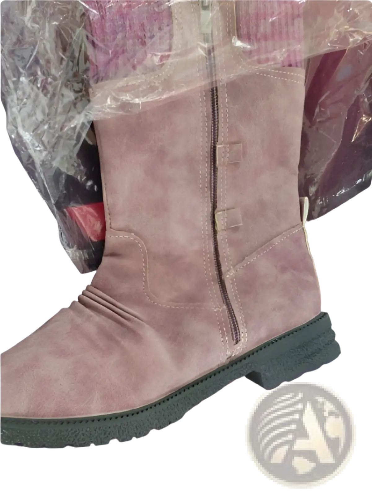 A dusty rose suede women winter snow ankle boot with black rubber sole and two rectangular buckle accents along zipper